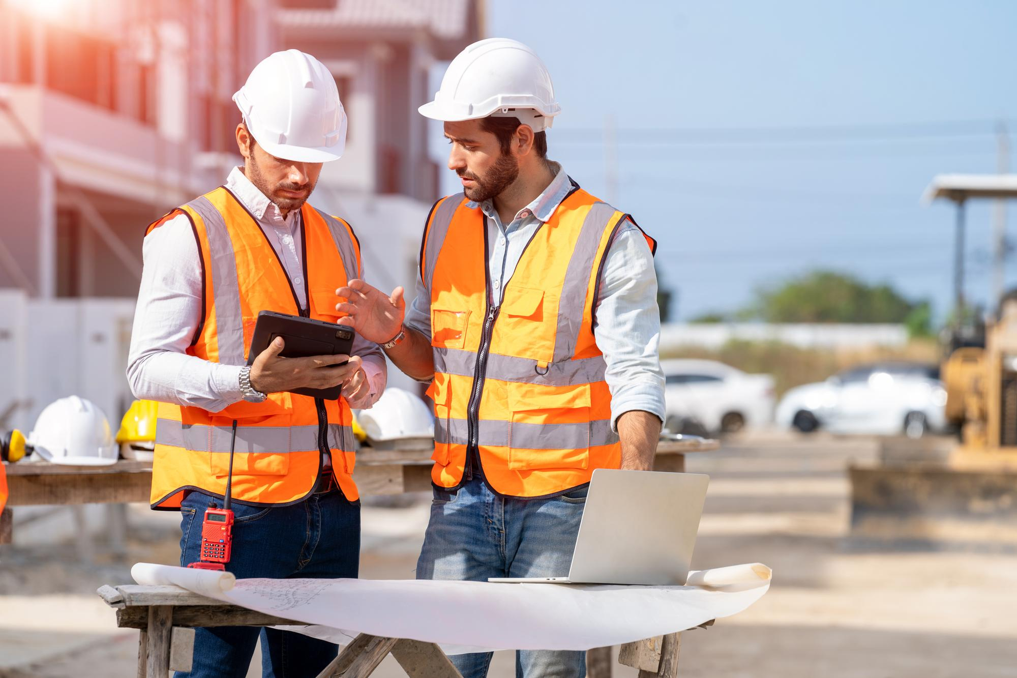 2 Contractors having a meeting at a construction site